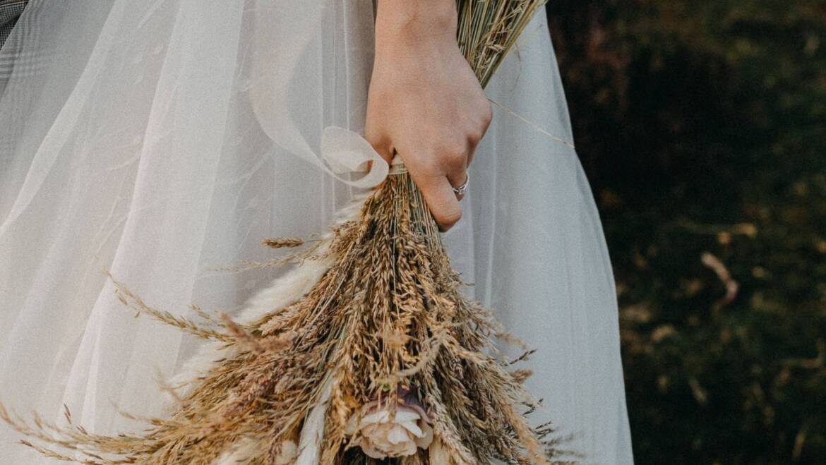 A delicate and expressive wedding bouquet crafted from dried flowers.