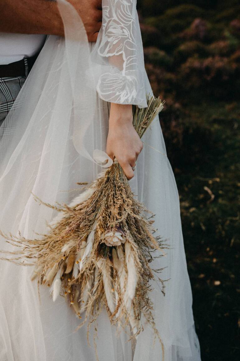 A delicate and expressive wedding bouquet crafted from dried flowers.