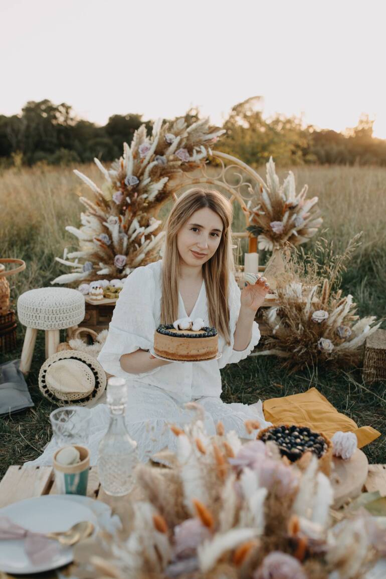 A stunning brand photoshoot that captures the essence of royal boho elegance, artfully highlighting the beauty of dried flowers in dusty pink shades.
