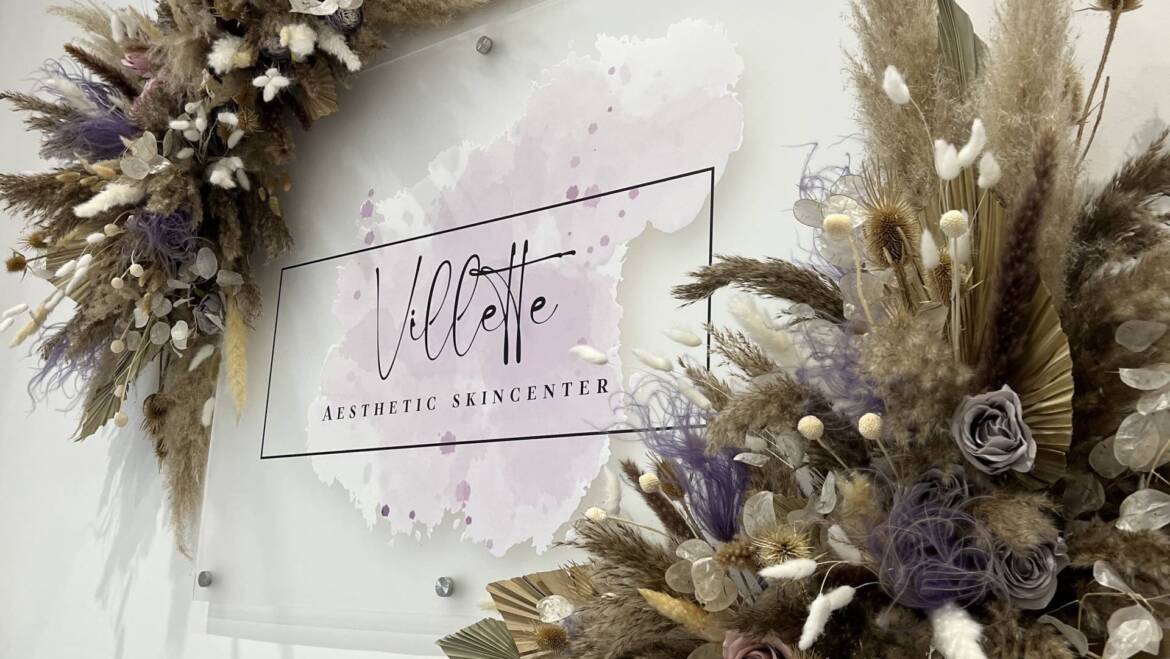 Floral installation that is both airy and opulent, highlighting a wide variety of dried flowers and plants in soothing shades of nude and lavender. Perfectly designed to enhance the brand identity of a skincare clinic logo.