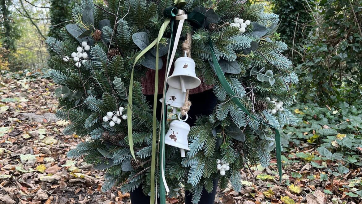 Festive decoration made of artificial greenery and berries in scandinavian style.