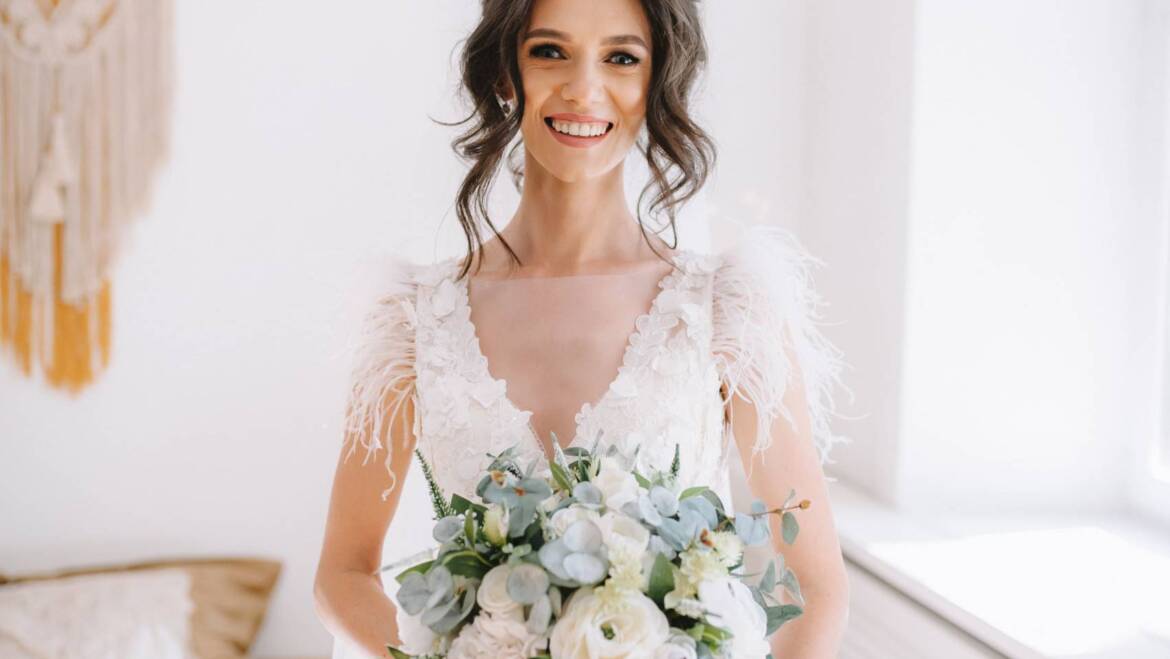 Everlasting white and deep green silk flowers wedding bouquet.