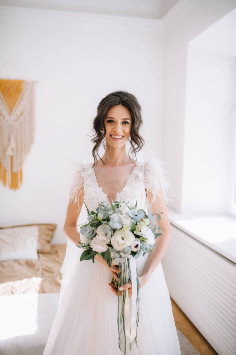 Everlasting white and deep green silk flowers wedding bouquet.