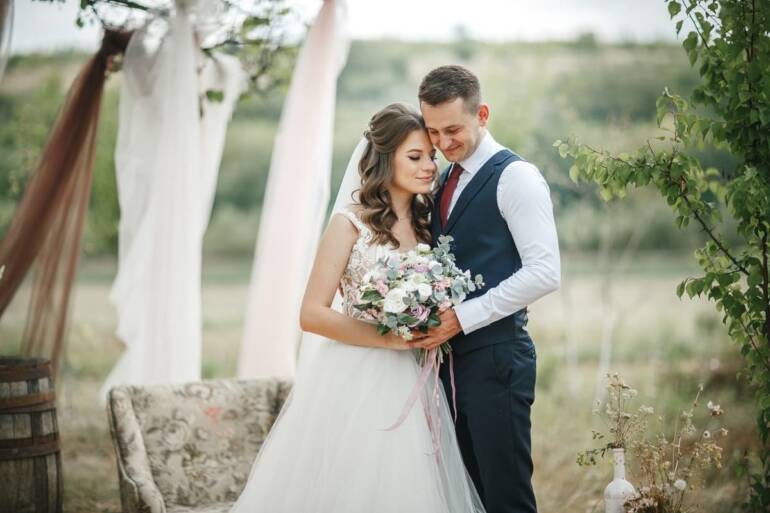 Wedding accessories from artificial flowers in a delightful mix of pink and white.