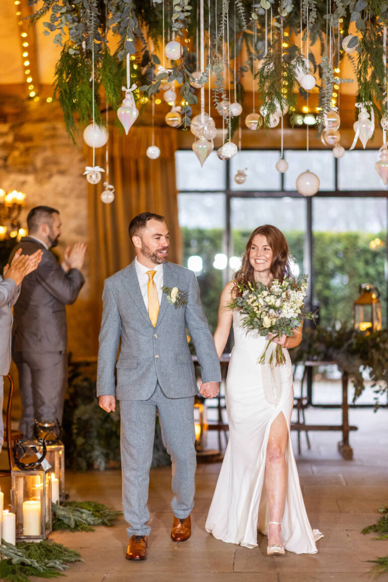 Lush evergreens and delicate thistle-  a romantic winter wedding, with sparkling white baubles, gently kissed by the warm glow of candles.
