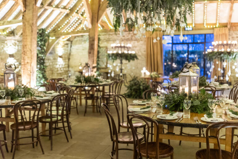 Lush evergreens and delicate thistle-  a romantic winter wedding, with sparkling white baubles, gently kissed by the warm glow of candles.