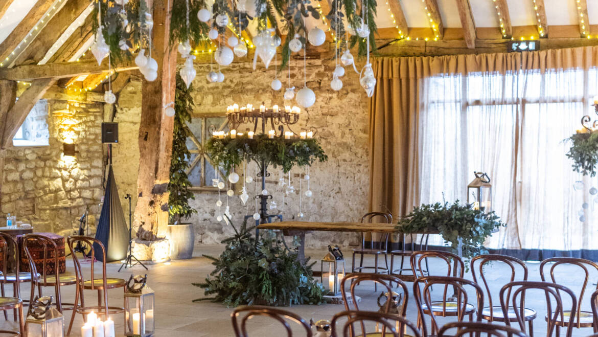 Lush evergreens and delicate thistle-  a romantic winter wedding, with sparkling white baubles, gently kissed by the warm glow of candles.