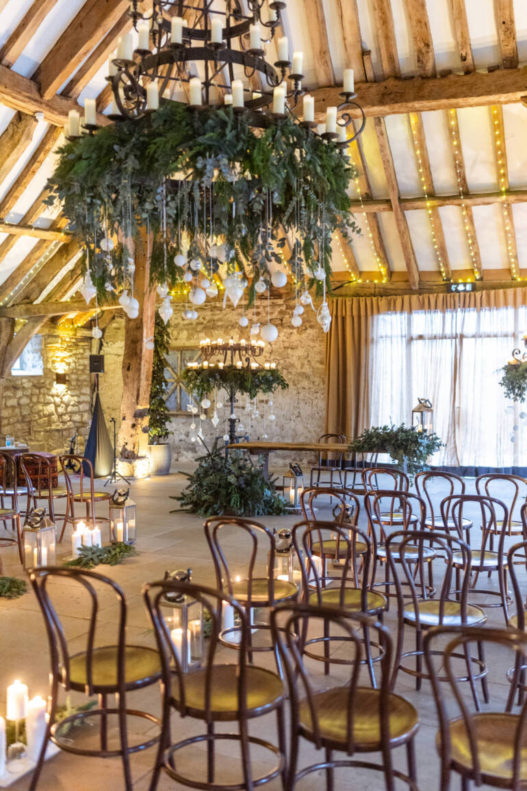 Lush evergreens and delicate thistle-  a romantic winter wedding, with sparkling white baubles, gently kissed by the warm glow of candles.