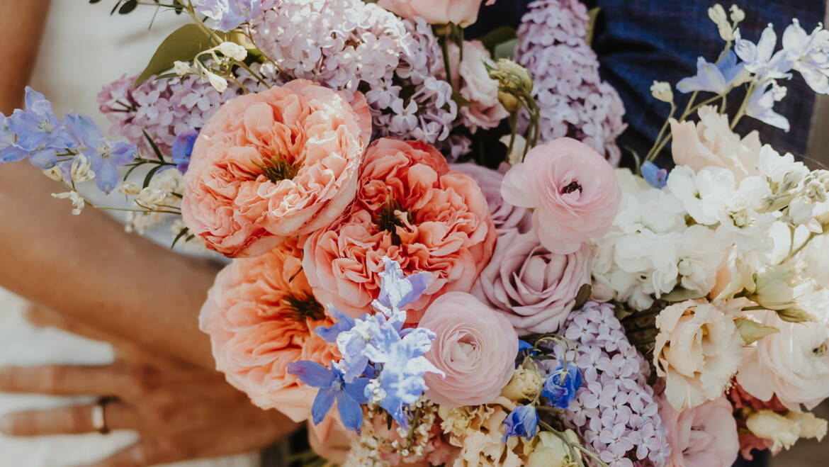 Bold, colorful bouquet of large, lush sping  blooms bursting together like a joyful rainbow, full of energy and life