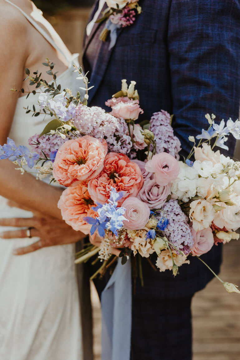 Bold, colorful bouquet of large, lush sping  blooms bursting together like a joyful rainbow, full of energy and life