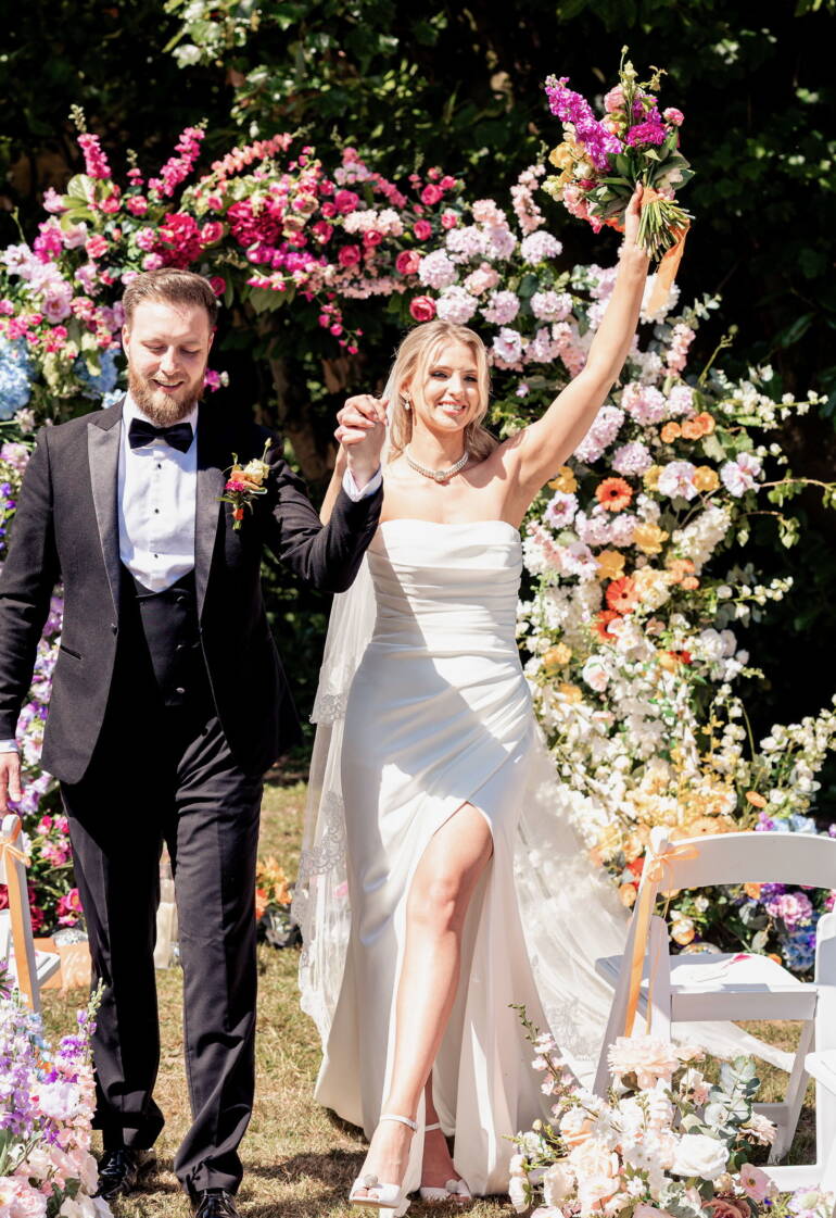 Bright summer flowers for a garden-style wedding, bursting with vivid colors and lush greenery, creating a cheerful, lively, and sunlit floral atmosphere