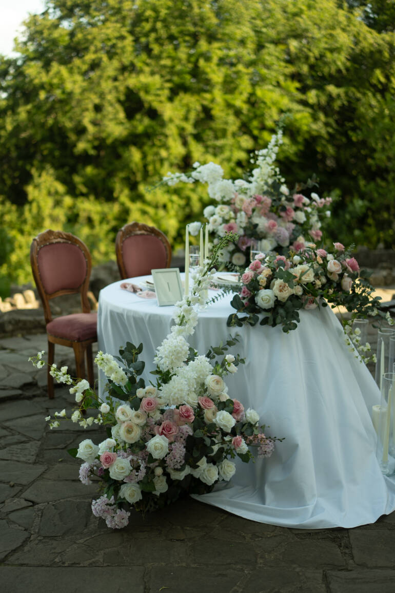 Symphony of white and pink blooms transforming the historical venue into a flower haven