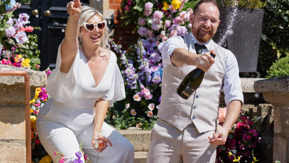 Cascading flowers in a bold, colorful mix flow through the wedding, intertwined with fresh, juicy citrus fruits – a vibrant, lively, and refreshing celebration