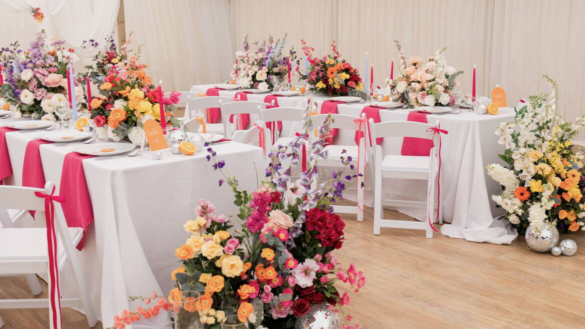 Bright summer flowers for a garden-style wedding, bursting with vivid colors and lush greenery, creating a cheerful, lively, and sunlit floral atmosphere