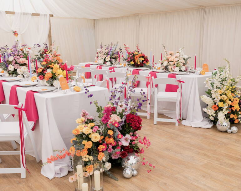 Bright summer flowers for a garden-style wedding, bursting with vivid colors and lush greenery, creating a cheerful, lively, and sunlit floral atmosphere