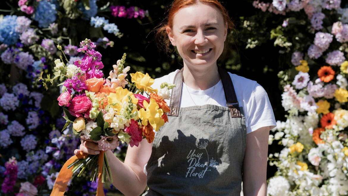 Bright summer flowers for garden-style wedding, bursting with vivid colors and lush greenery, creating a cheerful, lively, and sunlit floral atmosphere