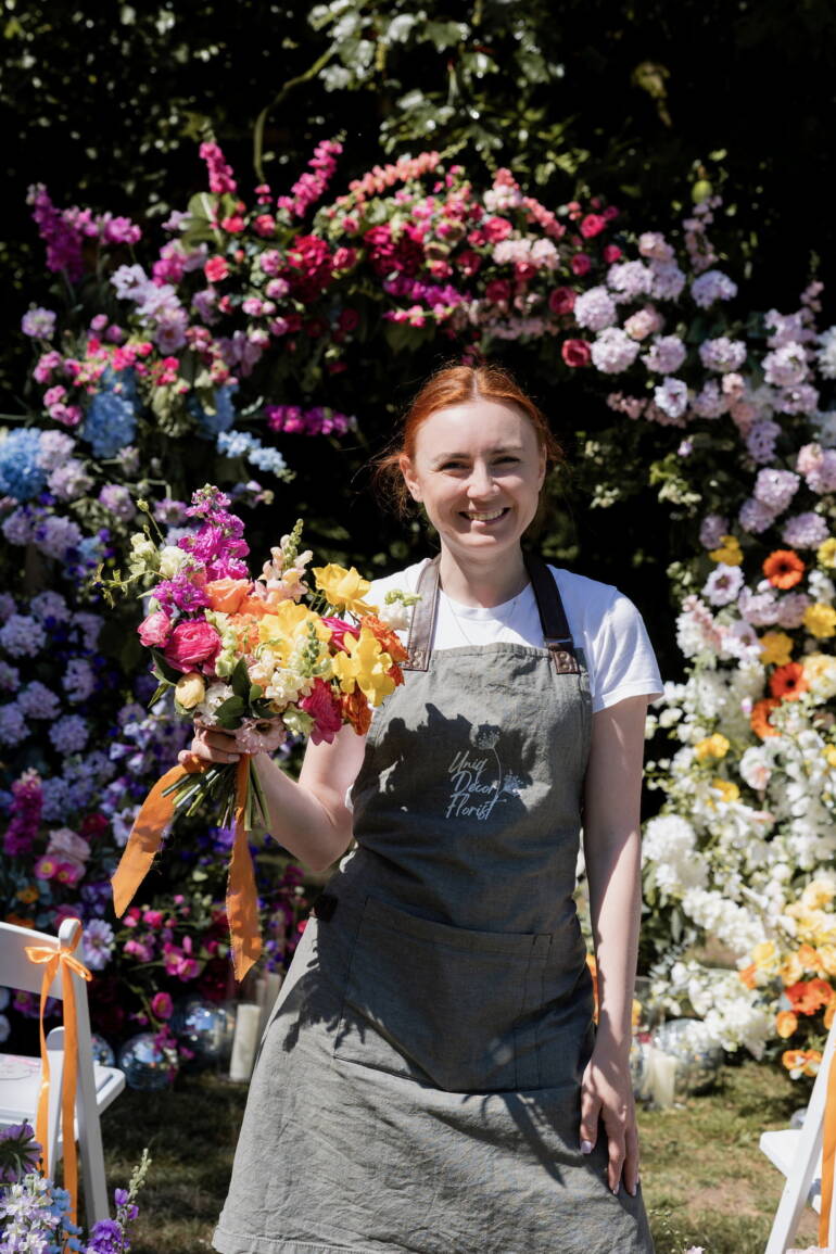 Bright summer flowers for garden-style wedding, bursting with vivid colors and lush greenery, creating a cheerful, lively, and sunlit floral atmosphere