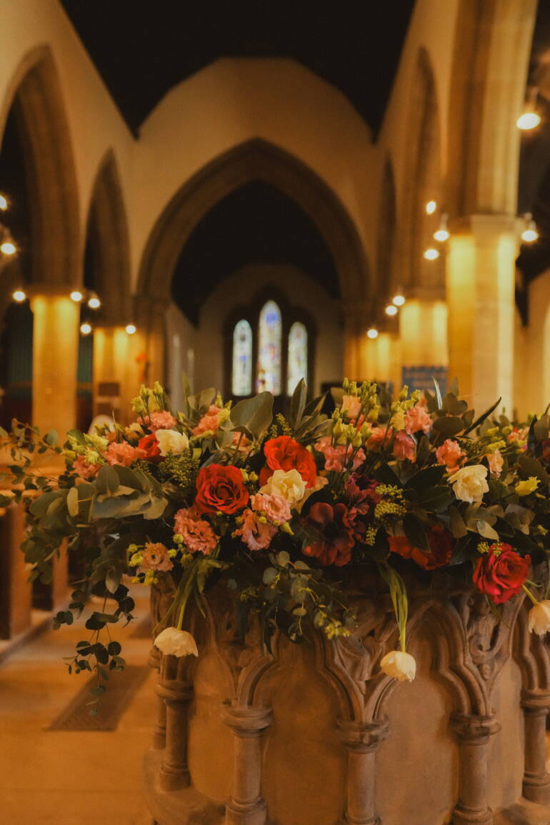 Fairytale-inspired ceremony with lush blooms and flowing greenery, creating a magical, romantic setting for “I do”